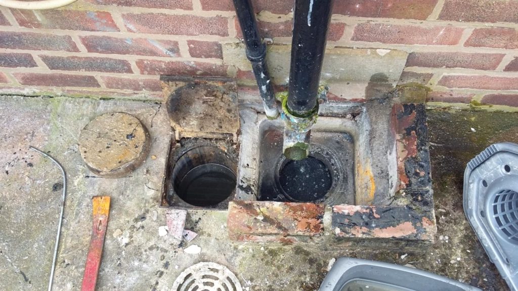 blockage-in-outdoor-drain-from-downpipe-debris