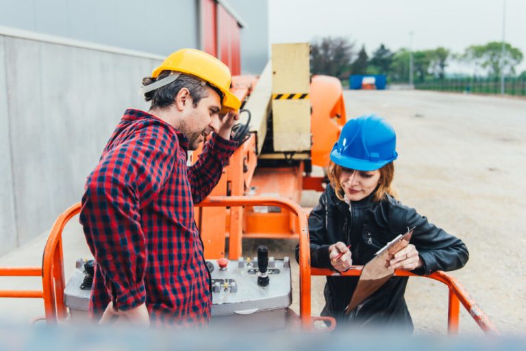 Operator,In,Safety,Helmet,And,Red,Square,Shirt,Receiving,Instruction