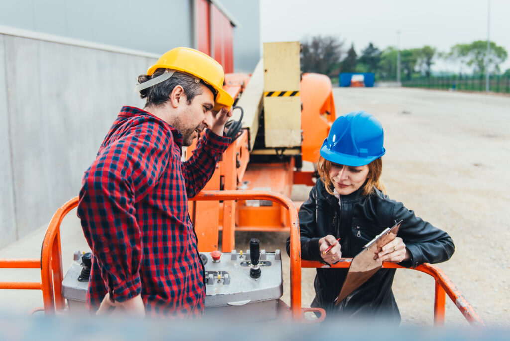 Operator,In,Safety,Helmet,And,Red,Square,Shirt,Receiving,Instruction