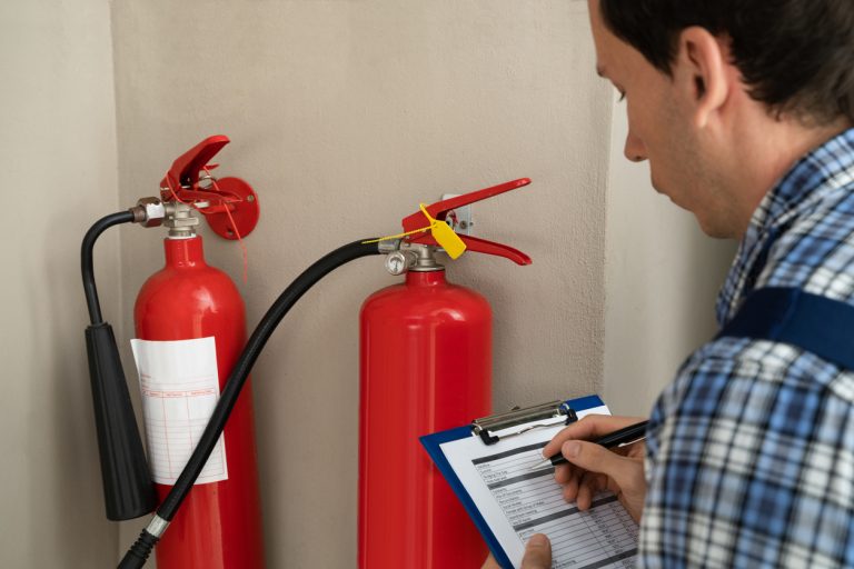 Professional Checking A Fire Extinguisher